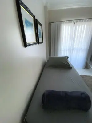 Uma cama ou camas num quarto em Apto Praia Mariscal