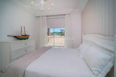 Uma cama ou camas num quarto em Linda Cobertura Praia de Lagoinha