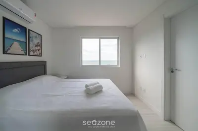 Uma cama ou camas num quarto em Apto vista mar 2Q prox praia Itapema SEM501