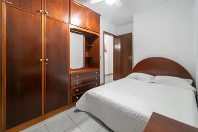 Uma cama ou camas num quarto em Aluguel Casa 3 Quartos para 8 Pessoas Bombas/SC