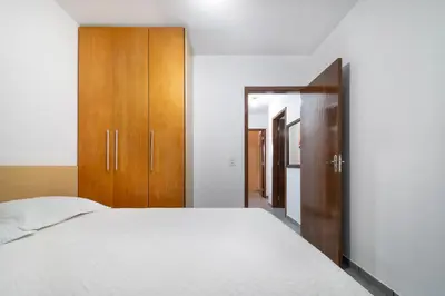 Uma cama ou camas num quarto em Aluguel Casa 3 Quartos para 8 Pessoas Bombas/SC