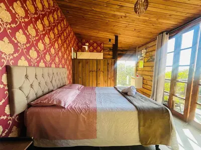 Uma cama ou camas num quarto em Praia de Palmas- Suíte 02