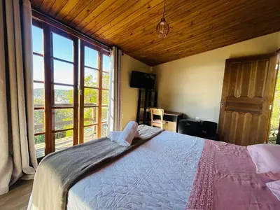 Uma cama ou camas num quarto em Praia de Palmas- Suíte 02