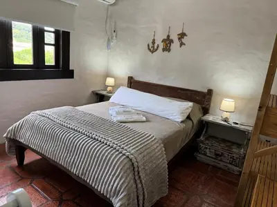 Uma cama ou camas num quarto em Bombinhas