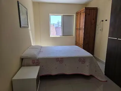 Uma cama ou camas num quarto em Res Mariscal em Bombinhas