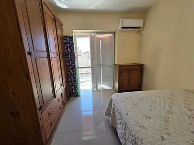 Uma cama ou camas num quarto em Res Mariscal em Bombinhas