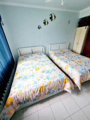 Uma cama ou camas num quarto em Res Palmeiras Bombinhas Centro