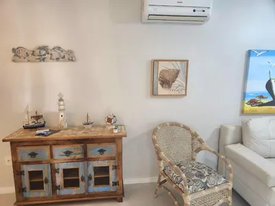 Uma área de estar em Apartamento Bombinhas Centro