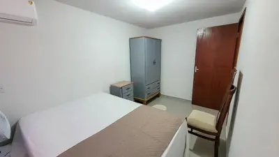 Uma cama ou camas num quarto em Casa a 2 quadras da Praia de Zimbros RW2724