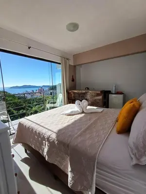 Uma cama ou camas num quarto em Suíte com vista panorâmica
