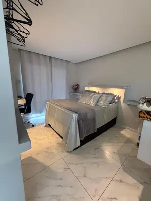 Uma cama ou camas num quarto em Loft proximo a diversas praias