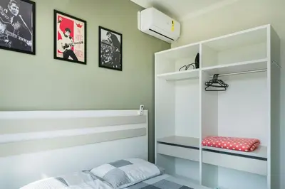 Uma cama ou camas num quarto em Residencial Florida II 150 mts do Mar