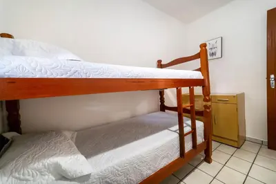 Uma cama ou camas num quarto em Aluguel casa 3 quartos Bombinhas SC