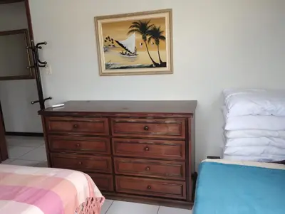 Uma cama ou camas num quarto em VIZINHO do ATLÂNTICO II 303