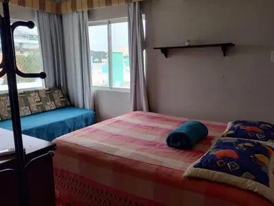 Uma cama ou camas num quarto em VIZINHO do ATLÂNTICO II 303