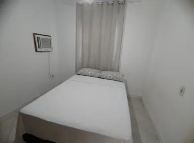 Uma cama ou camas num quarto em Ap 01 - 3 pessoas - Passarela de Bombas