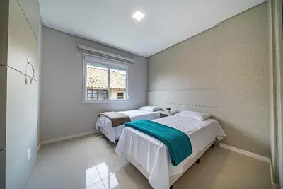 Uma cama ou camas num quarto em Edifício Costa Mexicana a 50 metros do Mar de Canto Grande