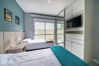 Uma cama ou camas num quarto em Edifício Costa Mexicana a 50 metros do Mar de Canto Grande