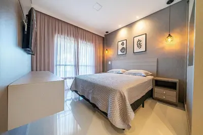 Uma cama ou camas num quarto em Edifício Costa Brava em Canto Grande Bombinhas