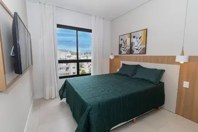 Uma cama ou camas num quarto em Adra 303 - Apartamento com 3 quartos - Centro de Bombinhas