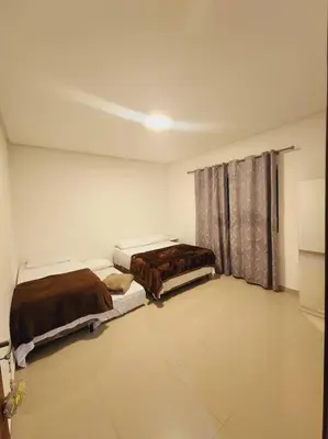 Uma cama ou camas num quarto em Casa Sunstay Garden com piscina