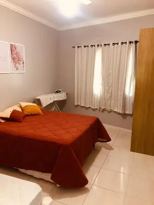 Uma cama ou camas num quarto em Aconchego do Mar