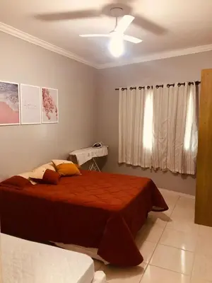 Uma cama ou camas num quarto em Aconchego do Mar