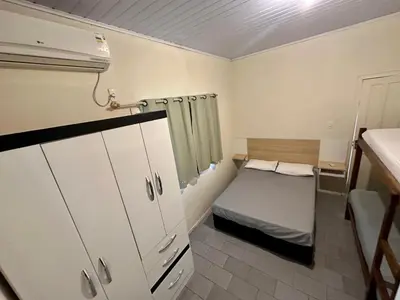 Uma cama ou camas num quarto em Apartamentos próximo ao Mar