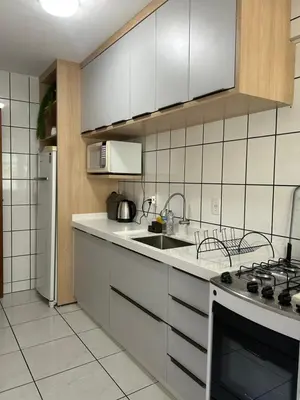 A cozinha ou kitchenette de Pé na Areia - localização imbatível a 20m do Mar