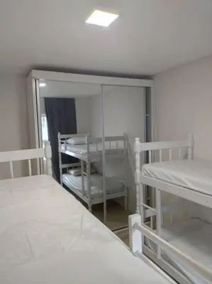 Uma cama ou camas num quarto em Aluguel em Bombinhas