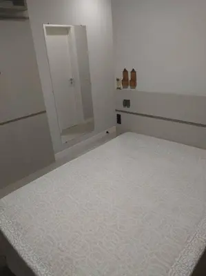 Uma cama ou camas num quarto em Aluguel em Bombinhas
