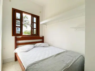 Uma cama ou camas num quarto em Residencial Verdes Mares