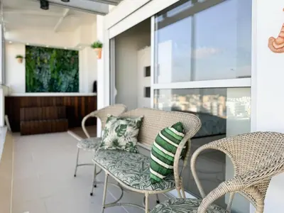 Uma área de estar em Cobertura com Jacuzzi em Palmas - GCR001