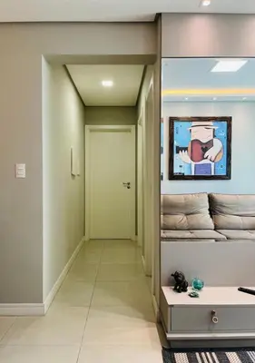 Uma televisão e/ou sistema de entretenimento em Apartamento na Praia de Palmas com garagem