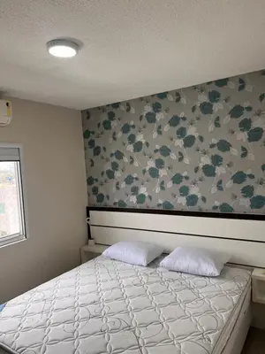 Uma cama ou camas num quarto em Bella praia bloco E 42