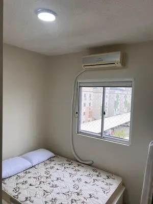 Uma cama ou camas num quarto em Bella praia bloco E 42