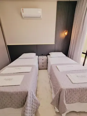 Uma cama ou camas num quarto em Privillege Residence 02