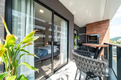 Uma varanda ou terraço em 203- Apart com vista mar e piscina