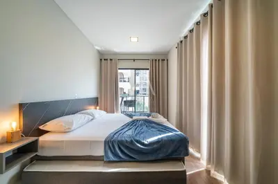 Uma cama ou camas num quarto em 203- Apart com vista mar e piscina