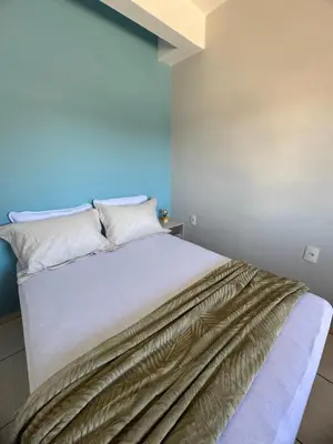 Uma cama ou camas num quarto em Residencial Golfinho - Palmas, Apto 03