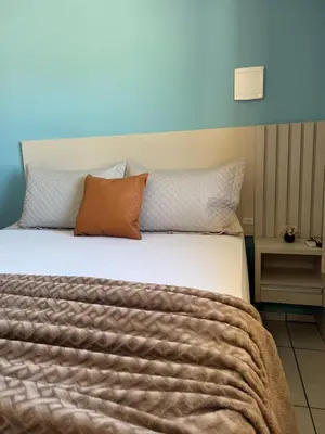 Uma cama ou camas num quarto em Residencial Golfinho - Palmas, Apto 03