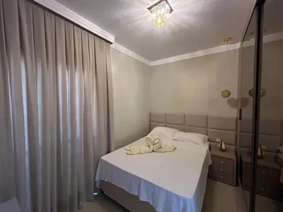 Uma cama ou camas num quarto em Apartamento confortável com piscina