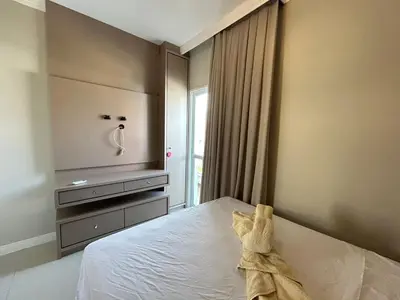Uma cama ou camas num quarto em Apartamento confortável com piscina