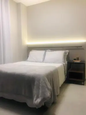Uma cama ou camas num quarto em apartamento confortável, Barra (102)
