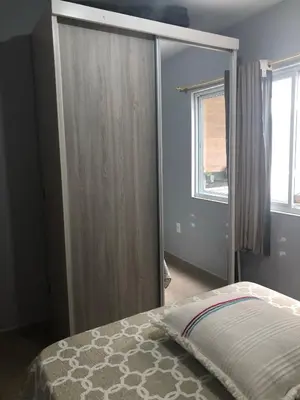 Uma cama ou camas num quarto em Apartamento casa Joel