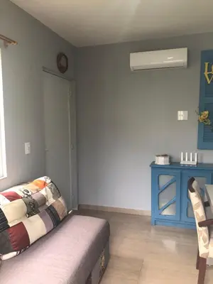 Uma área de estar em Apartamento casa Joel