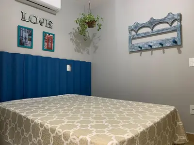 Uma cama ou camas num quarto em Apartamento casa Joel
