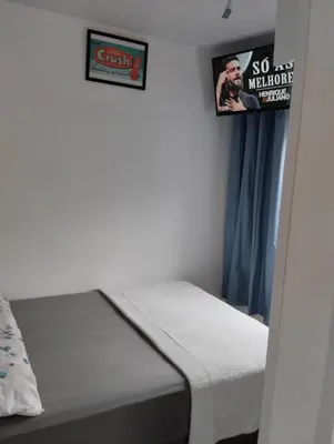 Uma cama ou camas num quarto em HORTA DO TOMATE