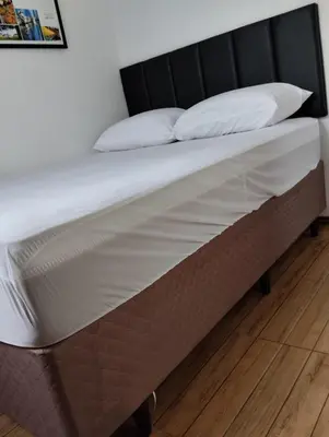 Uma cama ou camas num quarto em HORTA DO TOMATE