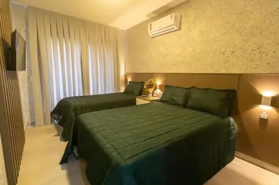 Uma cama ou camas num quarto em Solar do Atlântico 108 – Beira Mar em Bombas